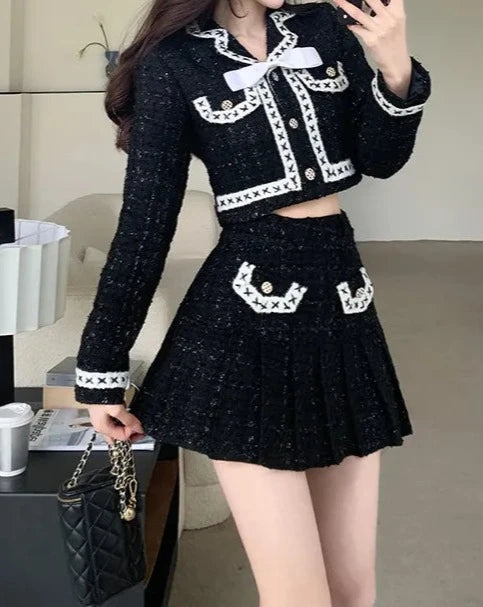 Women's black and white jacket and mini skirt suit