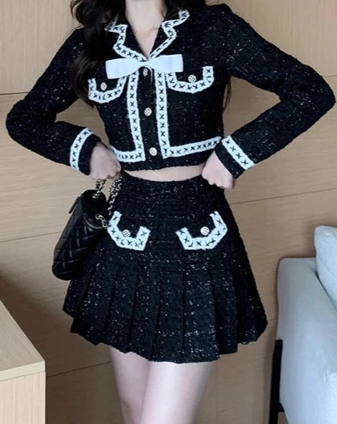 Women's black and white jacket and mini skirt suit